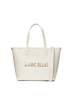 Crème-kleurige tote bag van soepel leer, met gouden "MARC ELLIS" branding, rechthoekige vorm en dubbele handvatten aan de bovenkant.