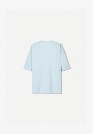 Light blue cotton t-shirt with a crew neckline, short sleeves, and a simple back design featuring a small horizontal seam detail.