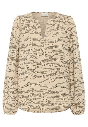 Beżowa bluzka z czarnym wzorem falistym, z dekoltem w kształcie litery V, długimi rękawami z marszczonymi mankietami oraz miękkim, teksturowanym materiałem.