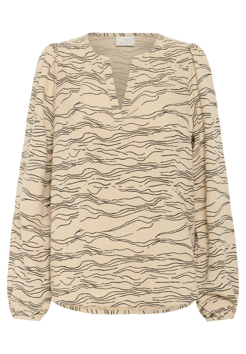 Blouse beige à manches longues avec motif de lignes ondulées noires, col en V avec légère ouverture du col et poignets élastiques froncés.