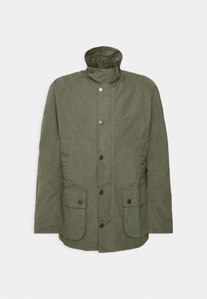 Olive green jacket with a high collar, button front, and two side pockets. Fabric has a soft texture and features button accents.