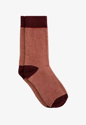 Calze a maglia con risvolto e punta color marrone bordeaux, caratterizzate da un motivo a nido d'ape texturizzato in beige e marrone bordeaux. Tessuto resistente con una vestibilità confortevole.