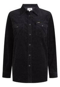 Black corduroy shirt with a button-up front, two chest pockets, and snap closures. Features vertical ribbing texture and point collar.