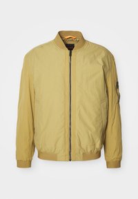 Žlutá bomber bunda, lehká látka, zapínání na zip vpředu, žebrovaný límec a manžety, boční kapsy, kapsa na zip na rukávu.