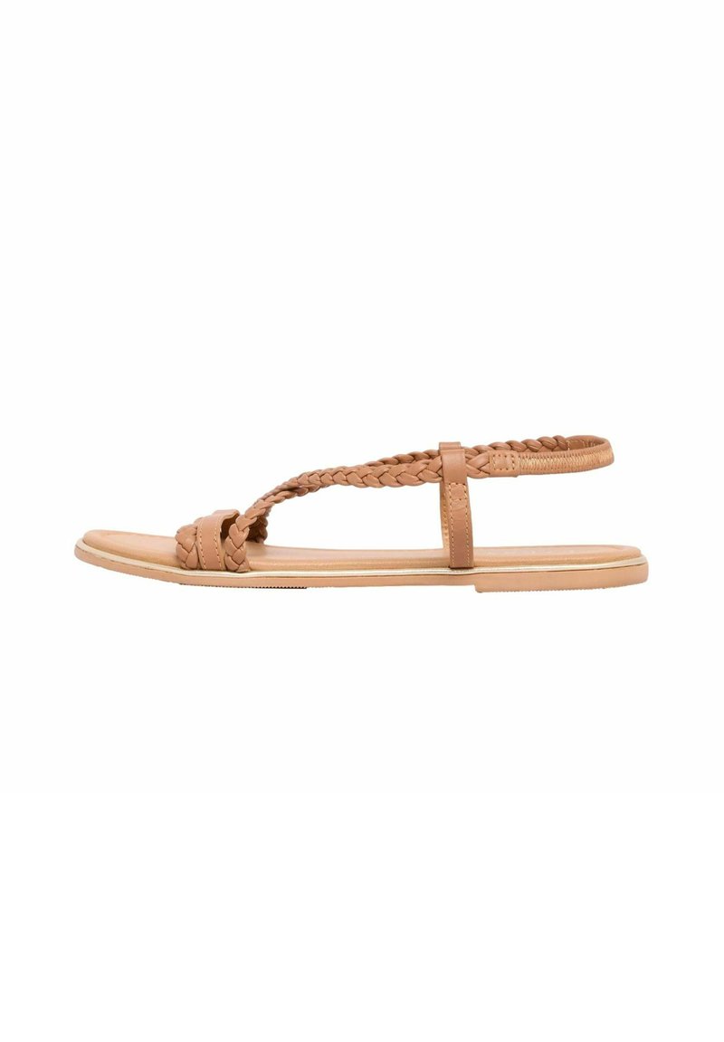 Tan flat sandals featuring braided straps and a minimalist design. The upper is made of smooth material, with a flat rubber sole.