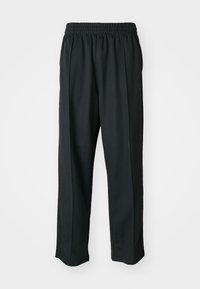 BAGGY - Tracksuit bottoms - black