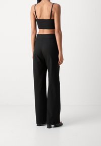 Lindex Pantalones - black