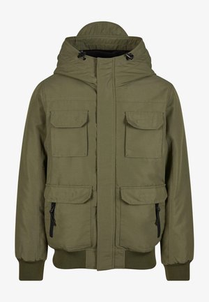 Olivengrønn jakke laget av glatt stoff, med hette, frontglidelås, fire frontlommer og ribbestrikkede mansjetter.