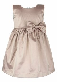 Ljus beige ärmlös klänning med en figursydd överdel, upplockad kjol och en stor rosett som accent vid midjan, tillverkad av slät tyg.