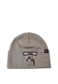 Berretto lavorato a maglia grigio con un design di tigre ricamato in bianco e nero e un'etichetta bianca con la scritta "TIGER" sopra.
