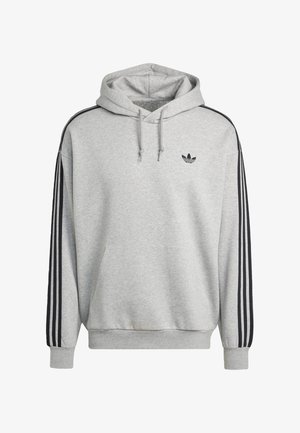 Sudadera gris con capucha, con rayas negras a lo largo de las mangas y un pequeño logo negro en el pecho. Tela suave, bolsillo delantero.