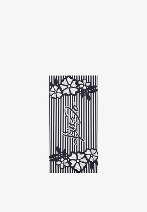 Tessuto a righe bianche e nere con motivi floreali in pizzo in alto e in basso e la parola "Fine" in corsivo al centro.