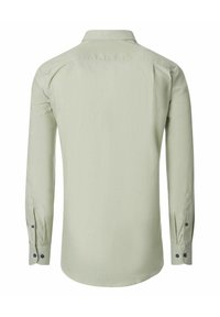 Lange mouwen shirt van lichtgroene stof met een kraag, knoopsluitingen aan de mouwen en een gebogen zoom. Eenvoudig ontwerp zonder patronen.