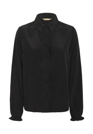 Blouse noire à manches longues avec un devant à boutons, détails floraux brodés sur les épaules et poignets à volants.