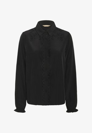 Črna bluzna majica z dolgimi rokavi, gumbom na sprednji strani, izvezenimi cvetličnimi detajli na ramenskih delih in z naborki na manšetah.