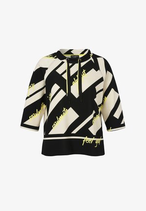 Black and cream geometric patterned short-sleeve hoodie with yellow drawstrings and scattered yellow cursive text.