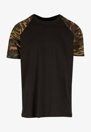 Black t-shirt with camo-patterned raglan sleeves. Made of soft cotton, featuring a crew neck and short sleeves. Casual fit, no graphics.
