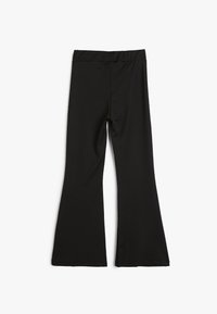 Sorte flared leggings lavet af strækbart stof. Har en høj talje, glat tekstur og en ensartet farve uden mønstre eller accenter.