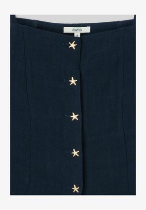 Vêtement bleu marine foncé avec des coutures verticales et cinq boutons dorés en forme d'étoile sur le devant, taille petite selon la marque BZB.