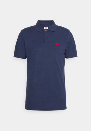 Marineblauwe polo shirt van katoen, met een twee-knopen sluiting en een klein rood logo op de borst. Korte mouwen, klassieke pasvorm.