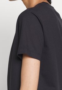 COACH Camiseta estampada - black