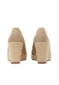 Beige suede wedge heels with a textured jute rope-covered heel, rounded toe, and smooth upper surface. Rear view highlights the heel's design.