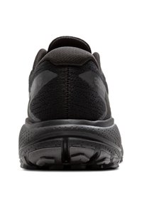 Zapato deportivo negro con una parte superior de tela texturizada, cuello acolchado y una suela de goma gruesa y con patrones que cuenta con orificios de ventilación.
