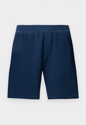 Pantalones cortos azul marino hechos de tela suave, con una cintura elástica y un corte recto. Sin bolsillos visibles ni adornos.