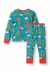 Light blue pajama set featuring gingerbread men, candy canes, and musical instruments; red cuffs and waistband accents. Soft, stretchy material.