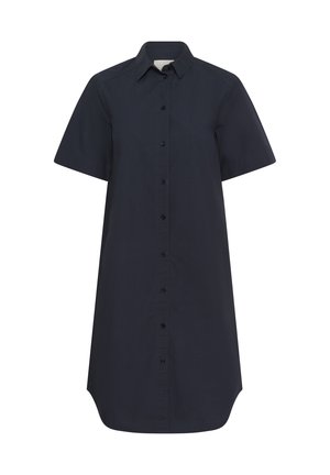 Jūras spēku īsu piedurkņu pogājams krekls, kas izgatavots no gludas auduma. Ar izcilu apkakli un taisnu griezumu, kuram ir garāka aizmugures apmale.