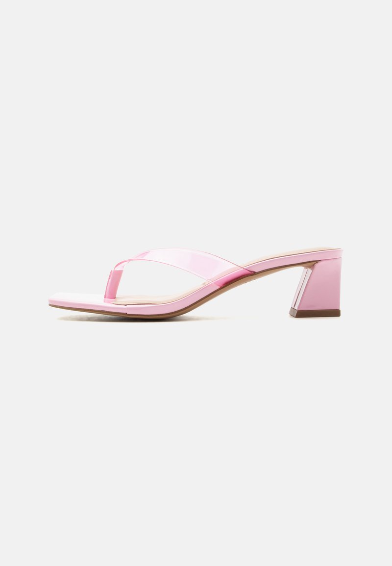 Pink open-toe heeled sandal with transparent straps and a block heel against a plain white background.