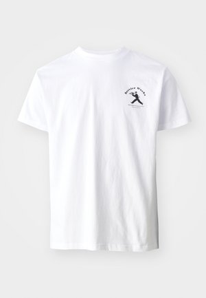 White cotton t-shirt featuring a black graphic print of a figure and text "Service Works" on the left chest area. Short sleeves, crew neckline.