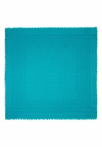 Écharpe rectangulaire turquoise avec des bordures à motifs subtils et des bords frangés, étalée à plat sur un fond blanc.