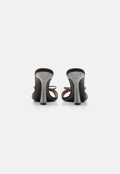 Black high-heeled sandals with an open back. The heels feature a rhinestone design, while the straps are thin and minimalistic.