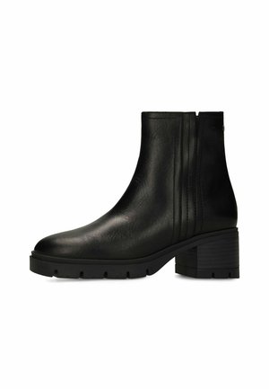 Black leather ankle boot with chunky block heel and elastic side panels, featuring a textured durable sole.