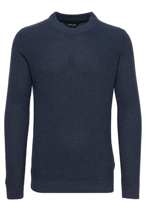 Dark navy knitted sweater with a crew neck, textured pattern, ribbed cuffs and hem, featuring a side logo tag.