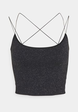 Haut court noir en tissu texturé, avec une finition scintillante. Il comporte des fines bretelles croisées dans le dos.