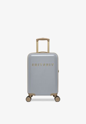 Hard-shell suitcase in grey with beige handle and wheels, featuring a telescopic handle and the brand name "SUITSUIT" on the front.