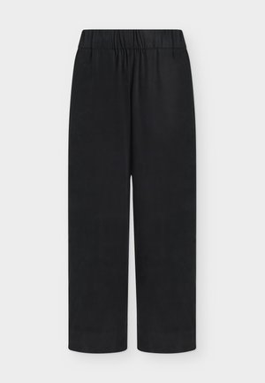 Svarte bukser med løs passform, elastisk midjebånd og rette ben på lys bakgrunn.