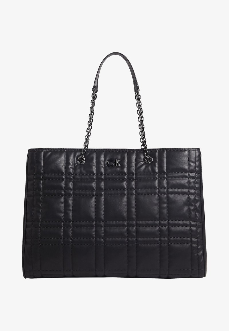 Black quilted tote bag with chain handles, made from smooth leather. Features a logo accent and padded square pattern on exterior.