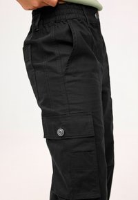 Next RIPS - Kareiviško stiliaus kelnės - black