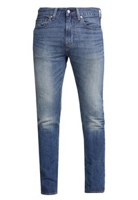 Denim jeans i mellanblått med en urtvättad effekt, fem fickor och rak bendesign. Har klassisk sömnad och metallspännen.