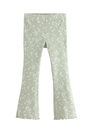 Lysegrønne bukser i ribstrikket stof med små hvide blomsterprint, vidde ved benene og flæsekanter ved kanten.