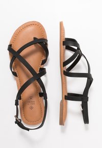 Call it Spring Sandaler m/ tåsplit - black