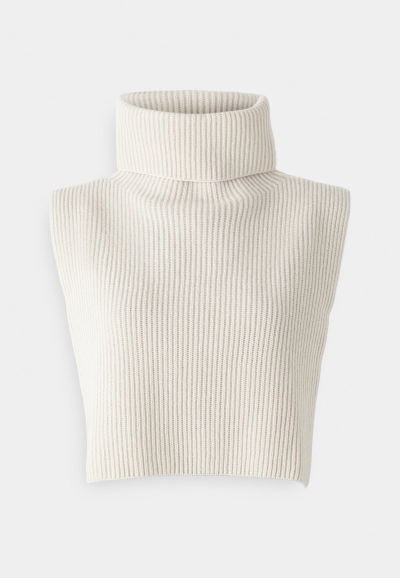 Gai bēšs, bez piedurknēm, turtleneck džemperis ar ribotu tekstūru. Iezīmē augstu kaklu un īsu dizainu.