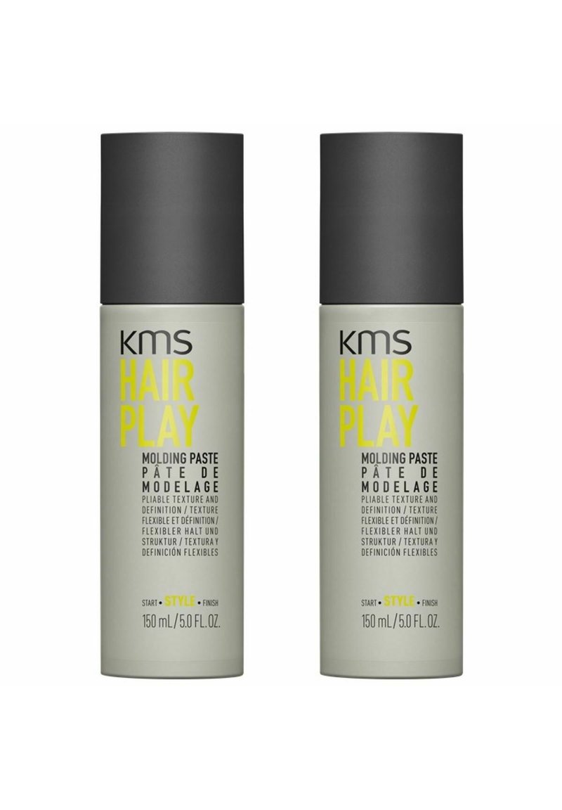 KMS Hair Play molding paste, two 150ml tubes, gray matte containers with black caps. Text in yellow and black, labeling product features.