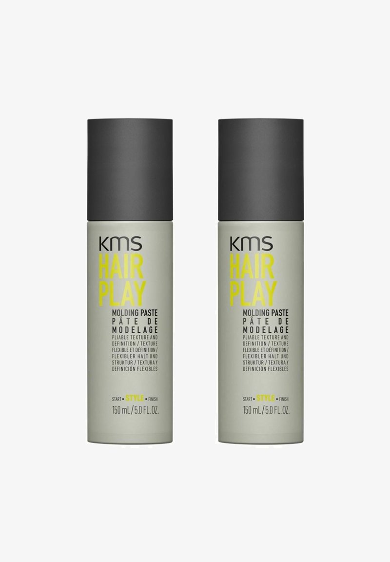 KMS Hair Play molding paste, two 150ml tubes, gray matte containers with black caps. Text in yellow and black, labeling product features.