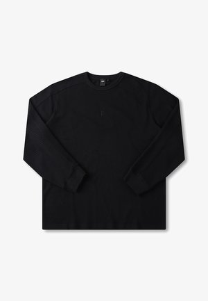 Black long-sleeve crewneck shirt with a textured pattern, ribbed cuffs, and a small logo detail on the chest. Regular fit design.