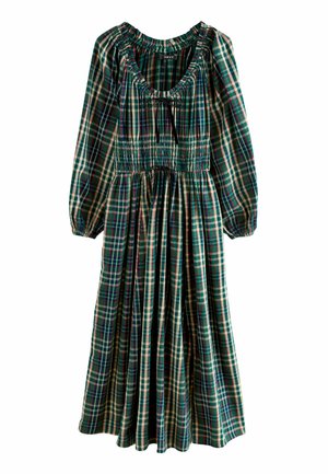 Green plaid dress with long sleeves, smocked waist, scoop neckline, and black drawstring. Fabric features varied plaid patterns in multiple colors.