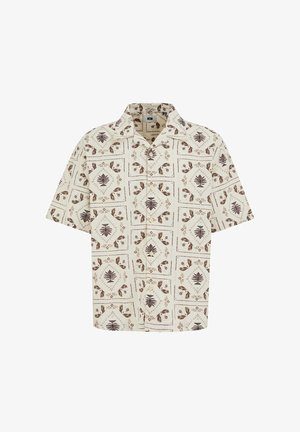 Kortärmelig overhemd met beige basis en bruine botanische patronen gerangschikt in vierkante rasterpatronen.